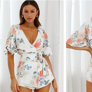 Adorable floral romper, ideal for summer, only worn once, in pristine condition.